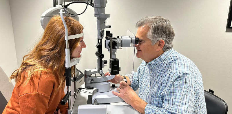 An eye doctor at Montana Eye Care carrying out an eye exam on a patient